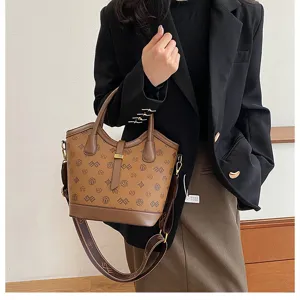 Vintage brown monogram bucket bag for women, large capacity shoulder and crossbody handbag.