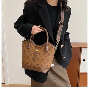 Retro brown monogram bucket bag for women, large capacity shoulder and crossbody handbag.