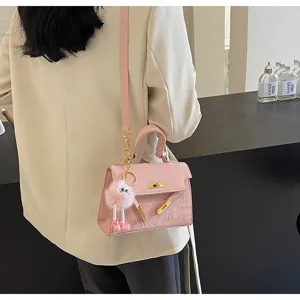 Trendy pink Kelly shoulder bag with cute plush pendant, chic daily messenger handbag.