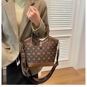 Retro monogram bucket bag for women, large capacity shoulder and crossbody bag with chic design.