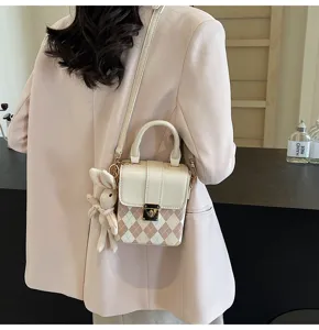 Chic checkered small crossbody bag for women, stylish shoulder phone bag with cute rabbit charm.