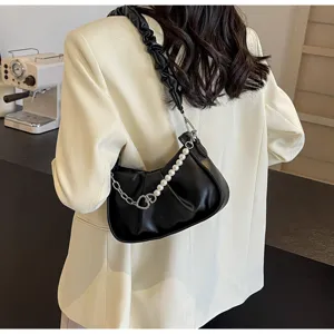 Black pleated shoulder bag for women, featuring elegant pearl and chain strap detail.