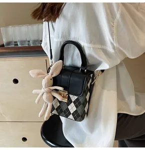 Mini black and white plaid crossbody phone bag with cute rabbit pendant for women.