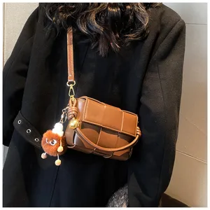 Brown woven leather shoulder bag crossbody handbag with plush charm for women