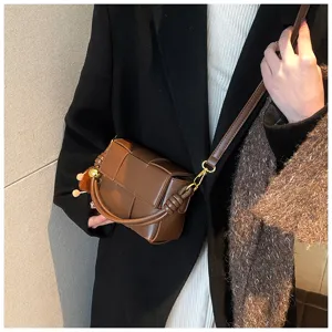 Brown woven leather shoulder bag detail, stylish small crossbody bag for winter women style.