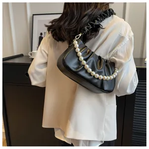 Stylish pleated shoulder bag with pearl chain strap, chic black cloud bag for women daily wear.