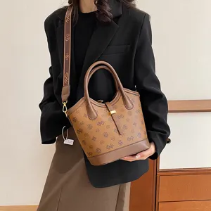 Vintage brown monogram bucket bag with top handle and shoulder strap for women daily use.