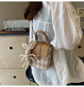 Stylish vintage plaid cross-body bag with cute knit bunny pendant for women daily fashion.