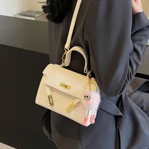 Korean style embossed Kelly shoulder crossbody bag for women with plush charm and gold hardware