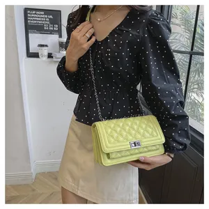 Yellow quilted chain crossbody bag for women, chic small square shoulder bag design.