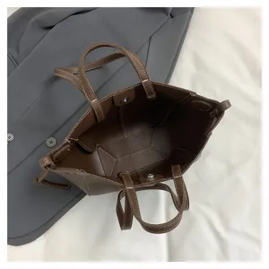 Detail view of the brown leather tote bag showcasing fine stitching and spacious interior.