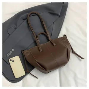 Dark brown leather tote bag stylish shoulder handbag with wing design and spacious capacity.