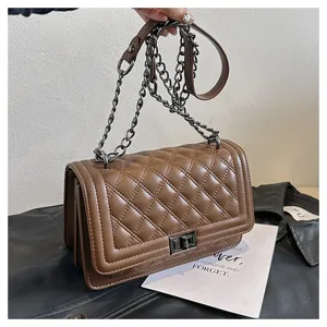 Brown quilted crossbody bag with metal chain strap, stylish shoulder bag for women.