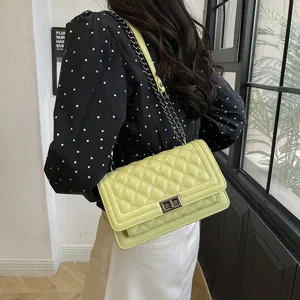 Green quilted chain shoulder bag for women, stylish crossbody bag with metal lock.