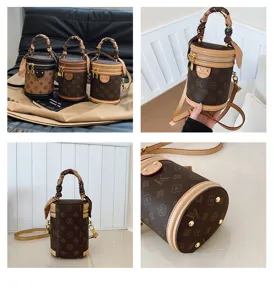 Sac seau cylindrique monogrammé vintage pour femmes, sac à bandoulière en cuir élégant.