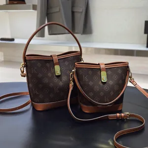 Vintage brown monogram bucket bag, luxury PU leather handbag, chic shoulder crossbody bag for women.