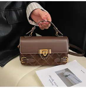 Vintage brown quilted leather handbag with chain and lock for women stylish winter crossbody bag.