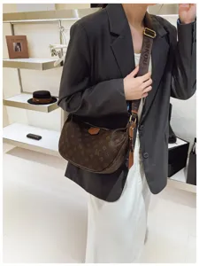 Trendy brown monogram crescent shoulder bag for women, stylish large capacity crossbody bag.