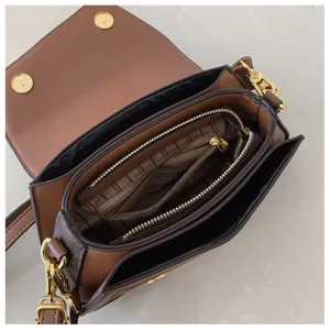 Stylish brown PU leather crossbody bag with multi-compartment interior and gold hardware.