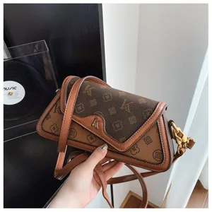 Detailed view of the stylish brown monogram colorblock underarm shoulder bag design.
