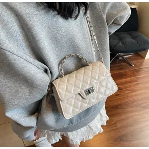 Quilted chain shoulder bag for women, chic beige crossbody bag with top handle and turn lock.