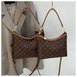 Stylish brown monogram shoulder bag for women, featuring classic patterned print and chic design.