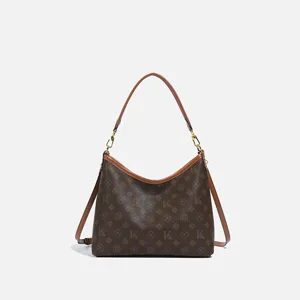 Classic brown monogram shoulder bag, stylish hobo handbag with crossbody strap for women.