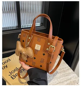 Korean style brown monogram bucket handbag with shoulder strap and cute bear charm.
