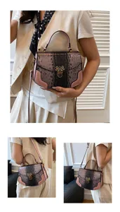 Detailed view of the stylish snake-pattern handbag with pink trim, studs, and versatile strap design.