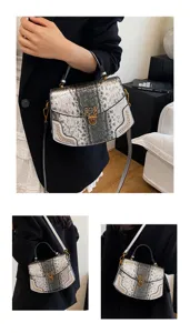 Detailed view of the chic snake print top-handle handbag, perfect for stylish crossbody wear.