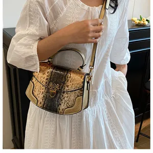 Detailed view of the metallic snake pattern women shoulder bag with top handle and chic clasp.