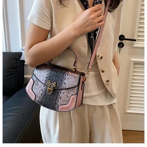 Stylish women's snakeskin gradient crossbody bag with pink trim and metal lock for daily wear.