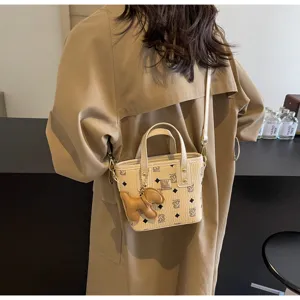 Korean style printed bucket bag for women, fashion shoulder crossbody handbag with charm.