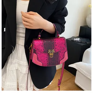 Chic pink snake-skin texture fashion handbag with gold hardware, perfect for daily wear.