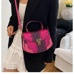Pink snake print top handle crossbody bag for women, stylish fashion shoulder bag detail view.