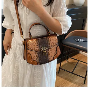Stylish snake print top handle shoulder bag for women, trendy leather messenger bag.