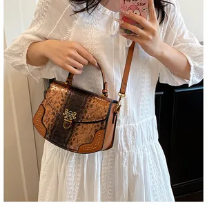 Stylish brown snake print PU leather handbag for women, trendy top handle crossbody bag.