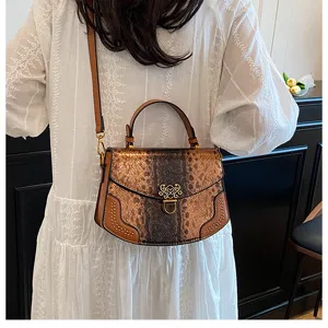 Chic snakeskin print top handle crossbody bag for women, stylish vintage shoulder bag.