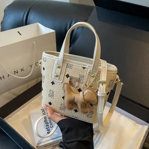 Korean style printed bucket bag, PU leather crossbody handbag with cute dog charm for women.