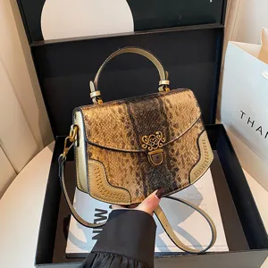 Chic snakeskin pattern top handle handbag with metal lock and shoulder strap for women.
