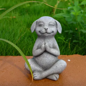 Detailed close-up of a cute meditating dog sculpture in yoga pose with stone texture for zen decor.