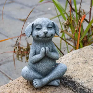 Detailed close-up view of a cute grey stone yoga meditating dog garden ornament piece.