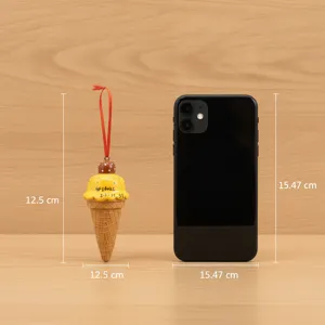 Detailed view of resin mango ice cream cone christmas tree hanging ornament with size reference.