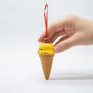 Close-up of mango ice cream cone Christmas tree hanging ornament made of eco-resin.