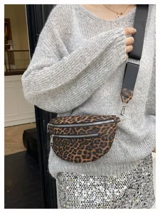 Leopard print crossbody chest bag detail shot showing PU leather and zipper pocket.