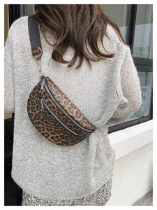 Leopard print crossbody chest bag detail view, showing stylish dual zippers and wide strap.