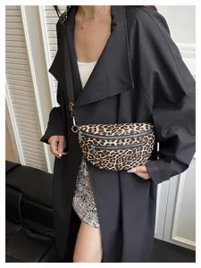 Leopard print fanny pack detail, stylish crossbody bag with dual zippers and chic design.