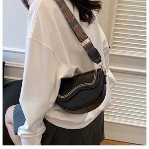 Retro black leather saddle bag with wide ethnic strap, versatile women shoulder bag.