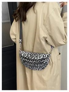 Detailed view of women's black and white leopard print chest bag, casual crossbody design.