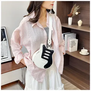 Stylish guitar-shaped crossbody shoulder bag for women, black and white color block design.